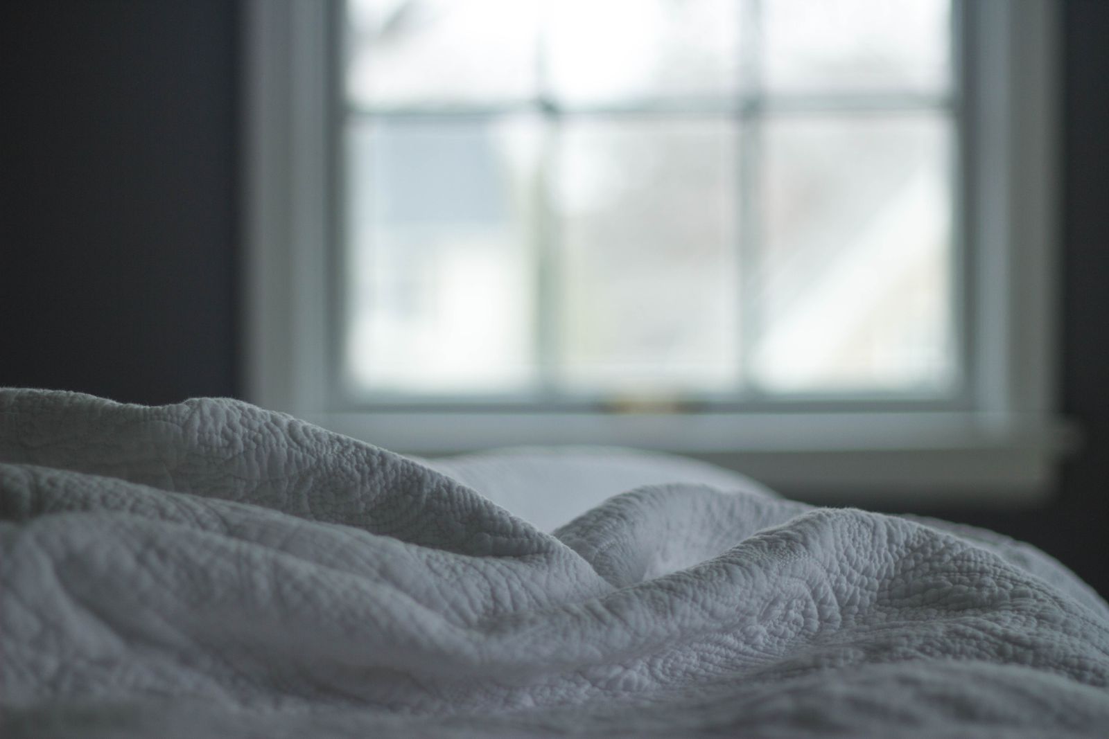 Soft morning light through a bedroom window