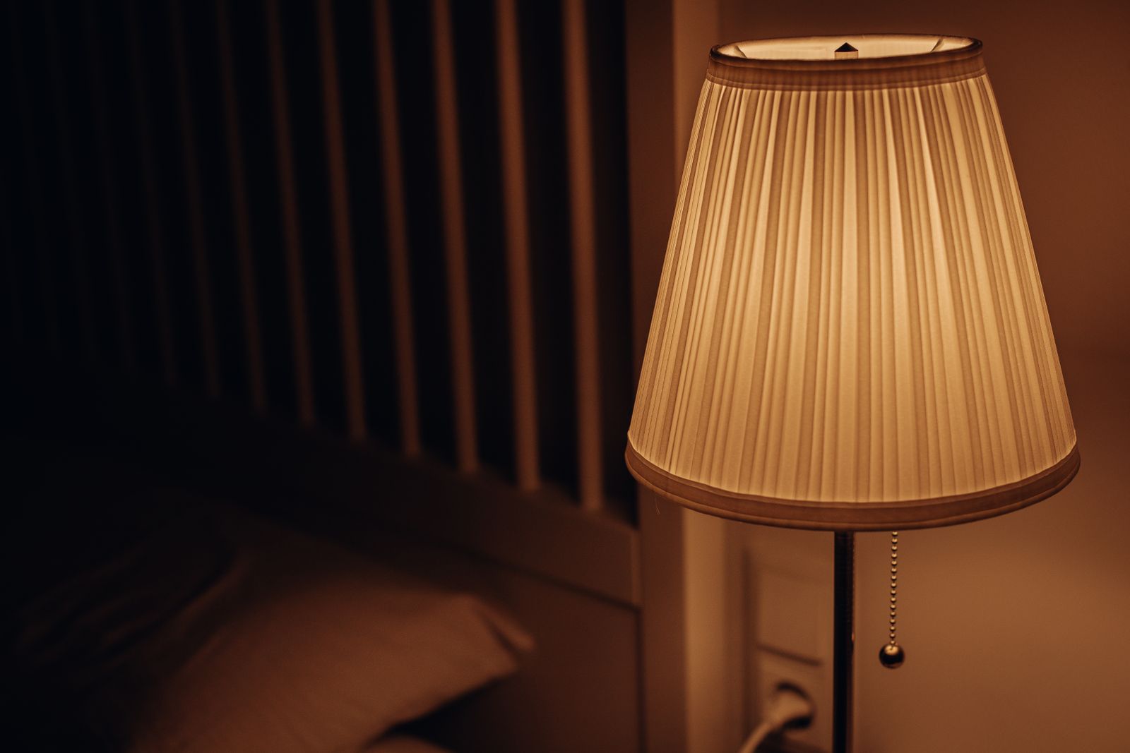 Relaxing in bed at night with soft, warm light